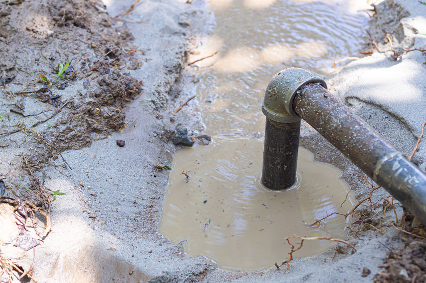 Close-up of pipe for groundwater drainage system pumps water out